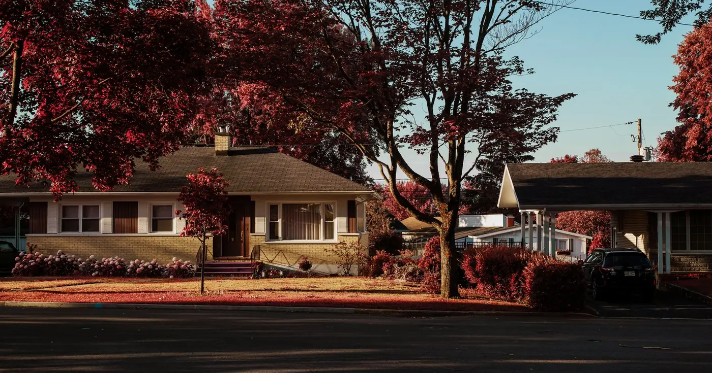 Shingle roofline on a single-story brick home, the roof being what last-resort property insurance covers